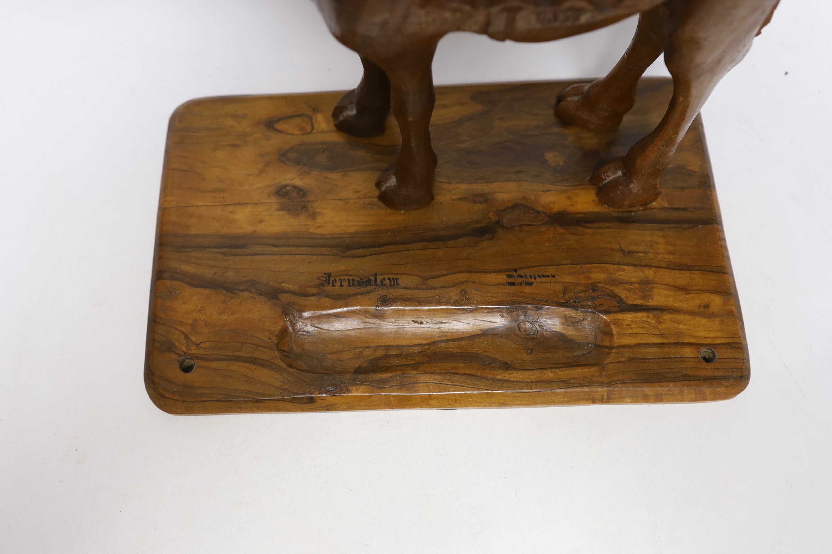 A Jerusalem carved olivewood camel pen / desk ink stand, 34cm wide